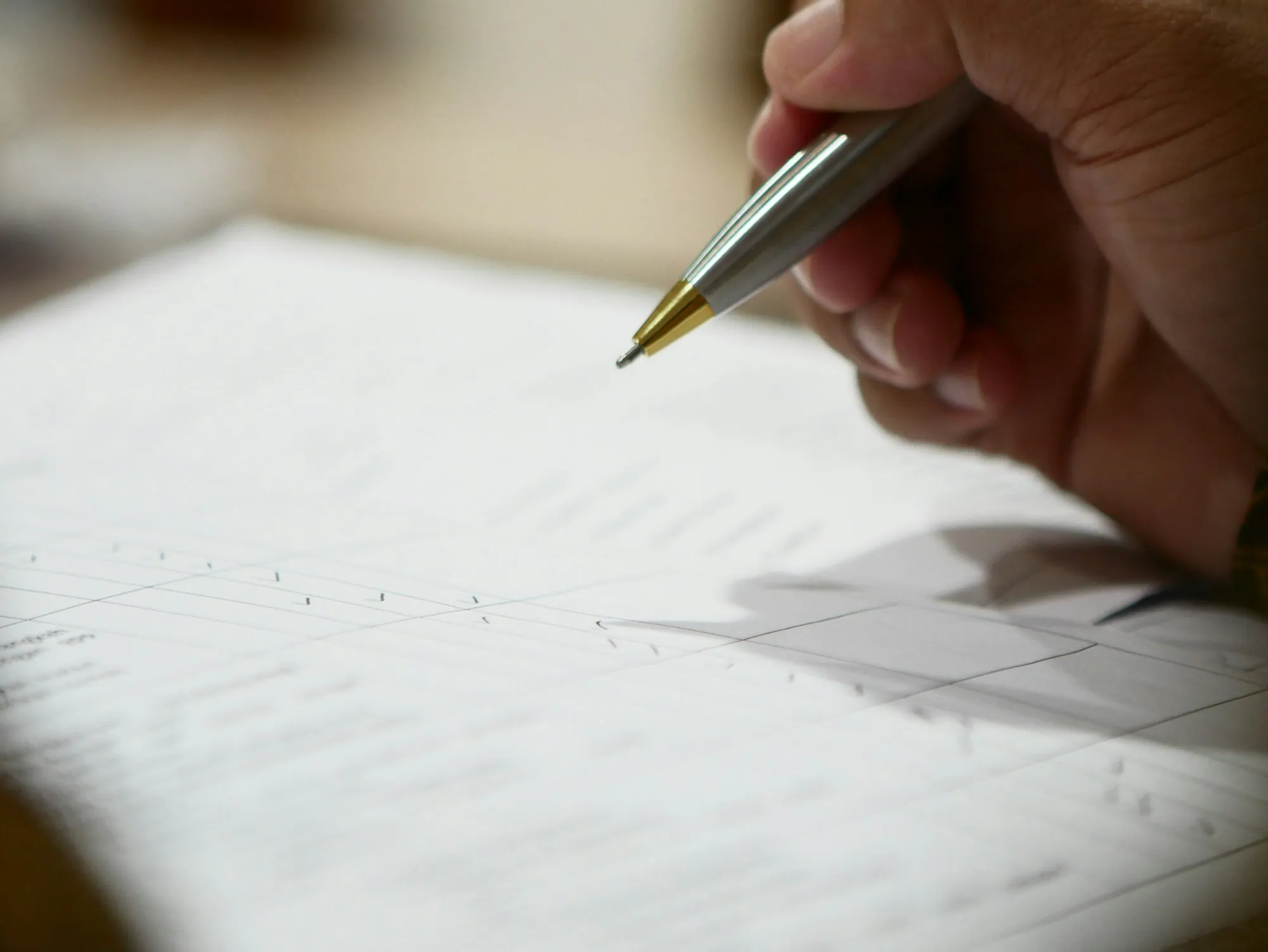 Close view of a pen over a printed page